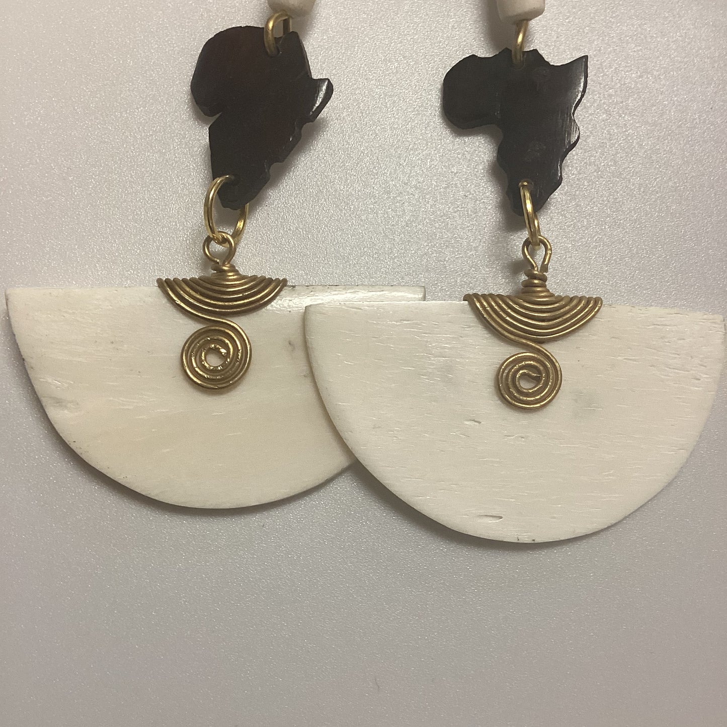 African map Brown half circle bone wrapped in brass earrings.