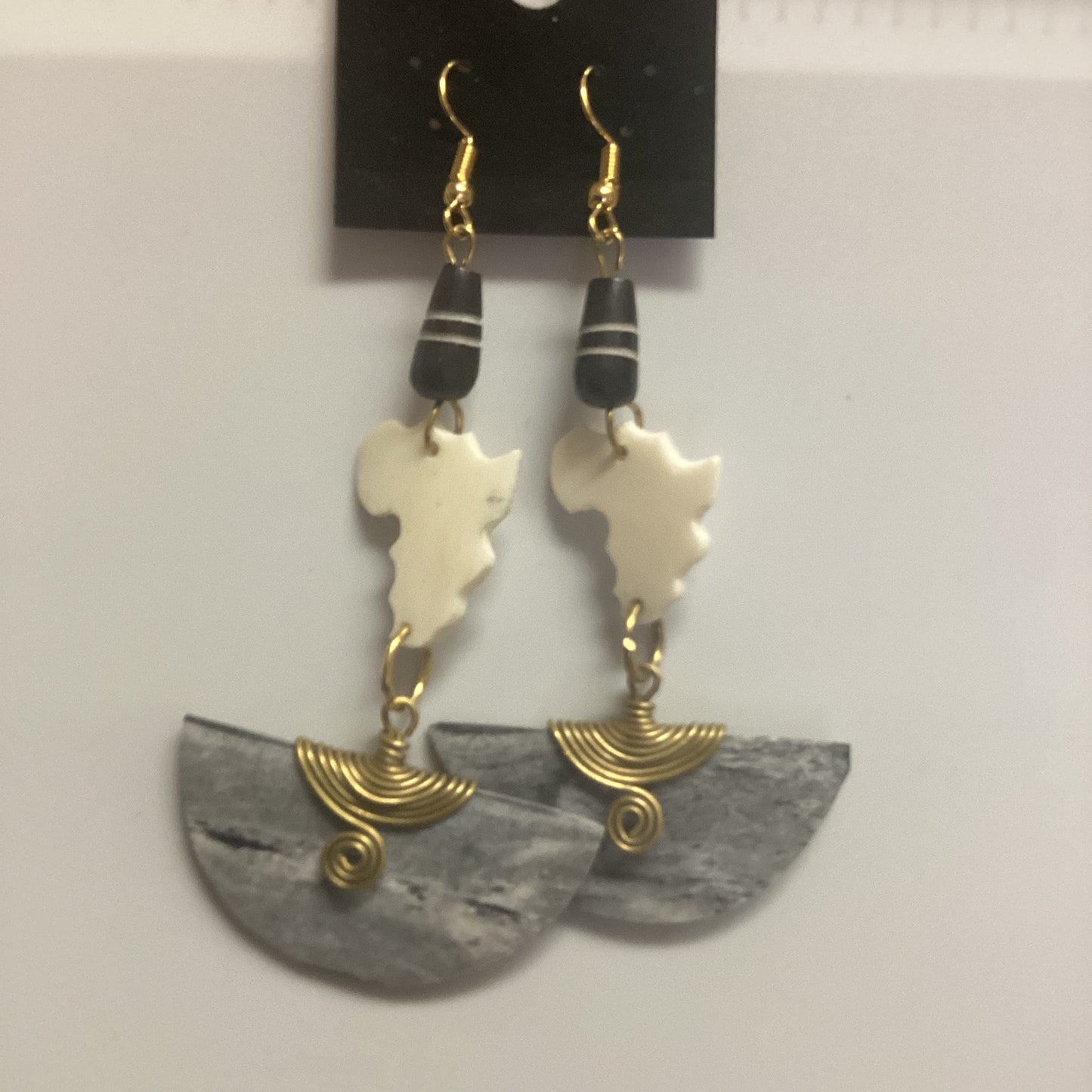 African map Brown half circle bone wrapped in brass earrings.