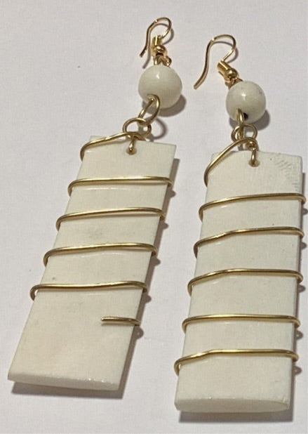 Off. White bone wrapped in brass earrings.