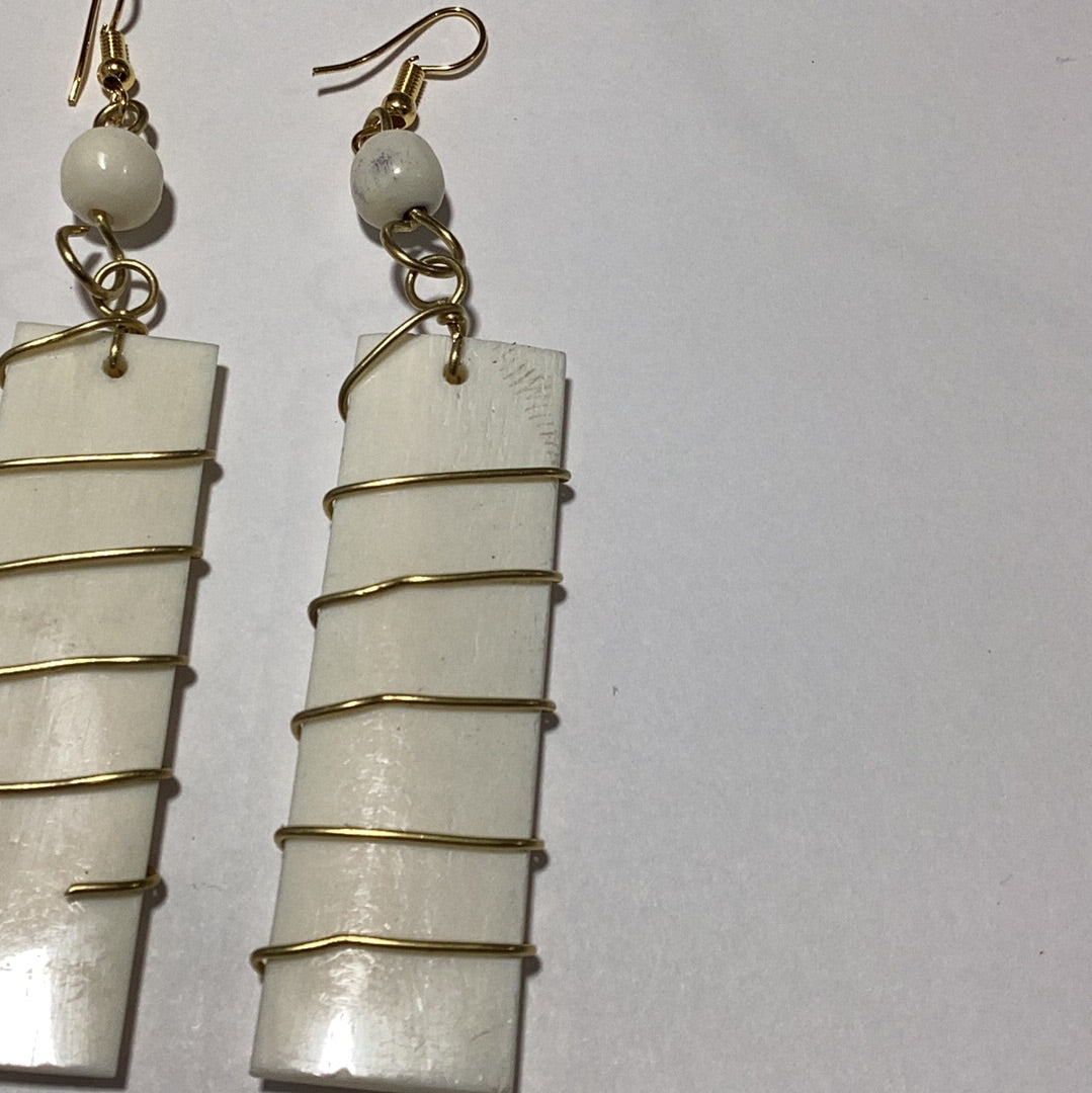 Off. White bone wrapped in brass earrings.