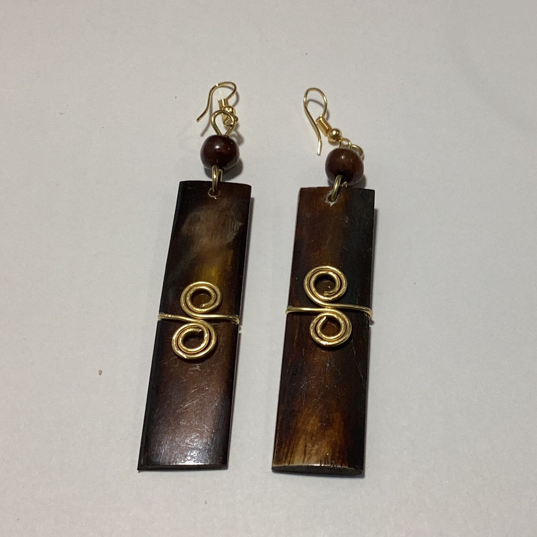 Brown bone wrapped in brass earrings.