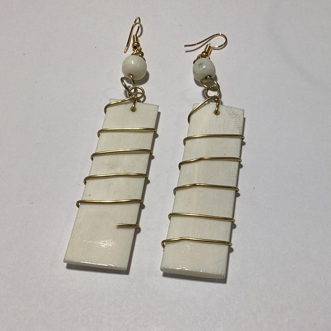 Off. White bone wrapped in brass earrings.