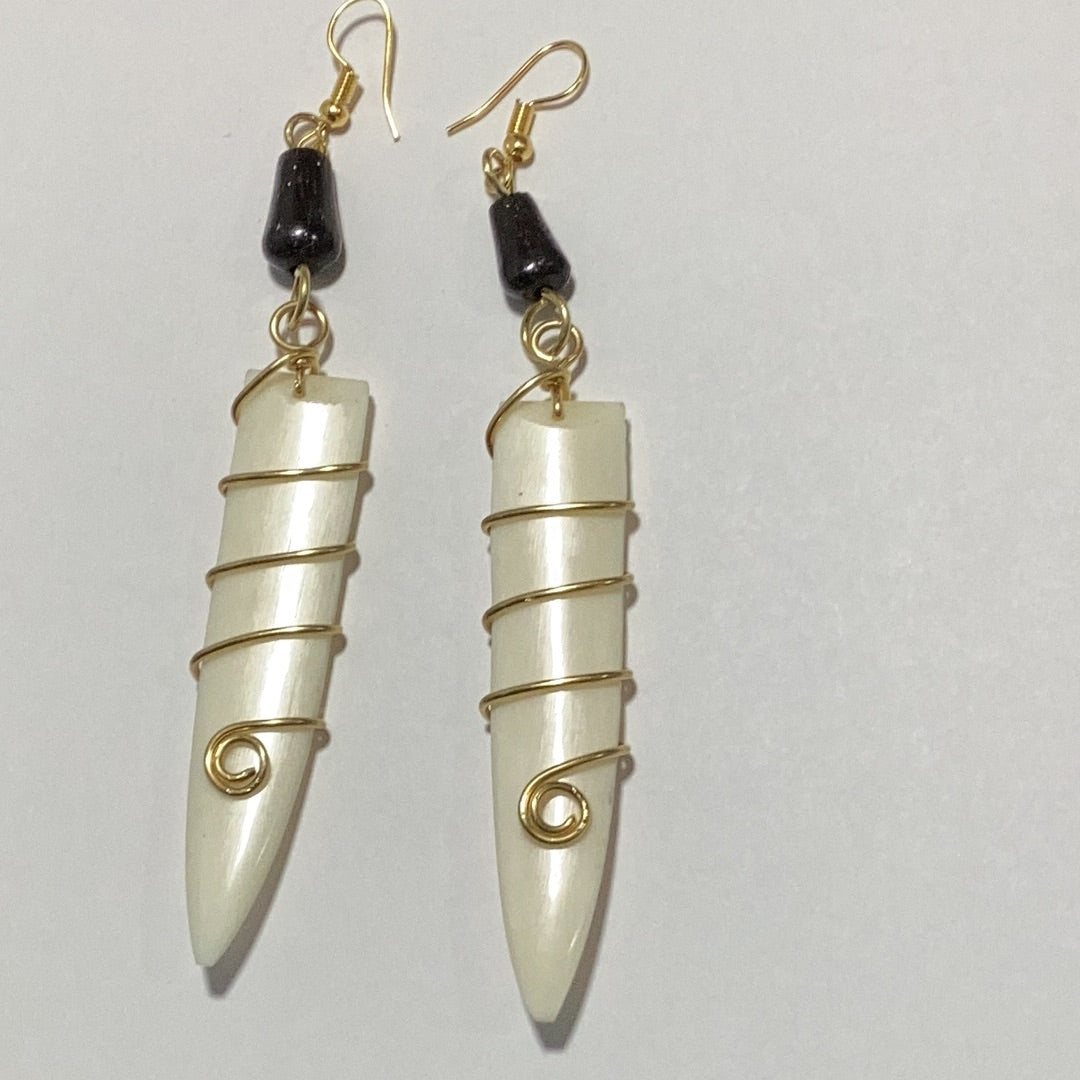 Off white bone wrapped in brass earrings.